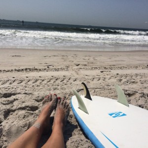 Post-surf sess toes in the sand in Long Beach